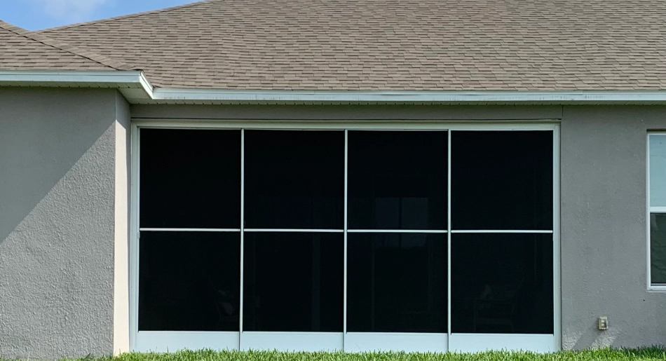 a house showcasing a sliding garage screens
